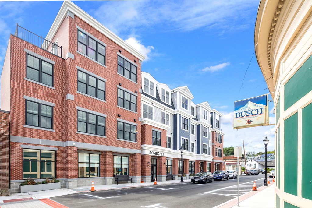 a street view of a building with a sign in front of it