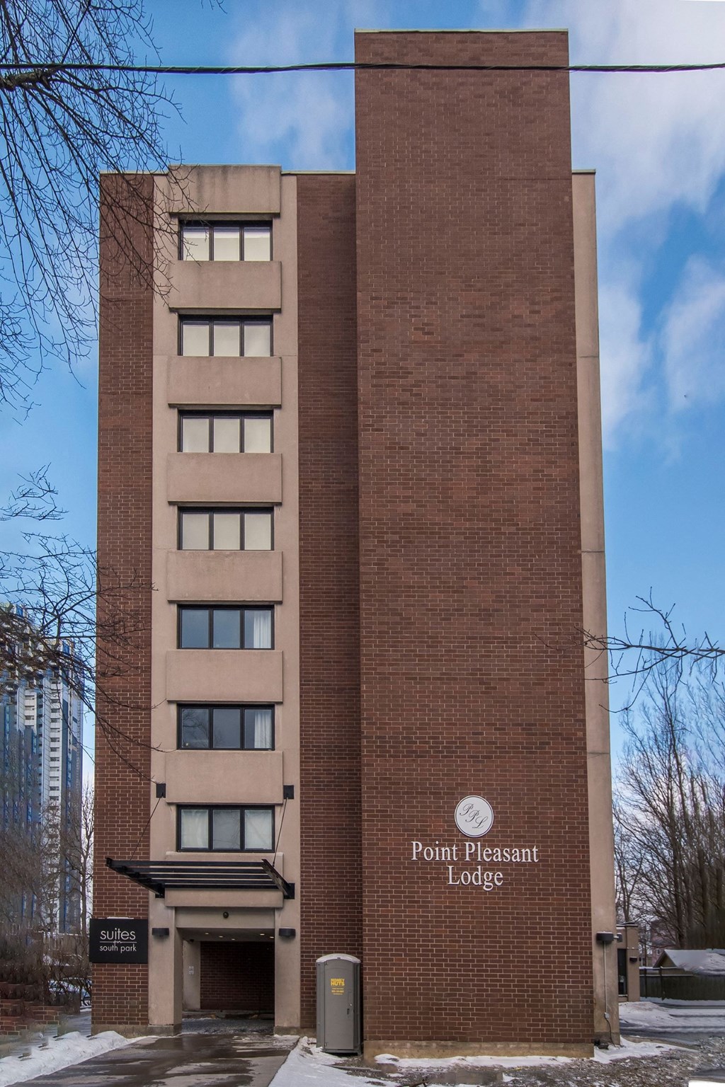 a brick building with a sign that reads point pleasant lodges