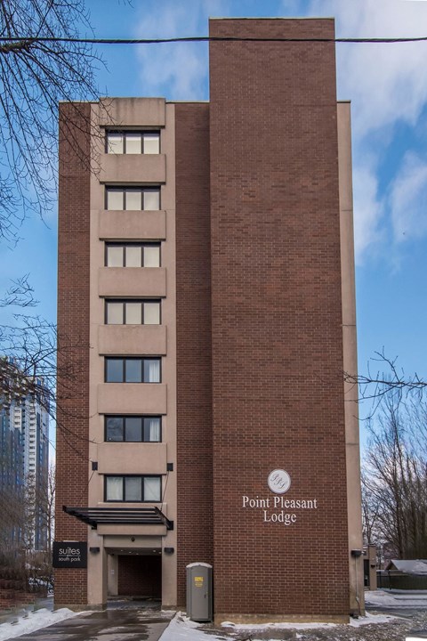 a brick building with a sign that reads point pleasant lodges