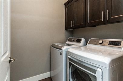 a kitchen with a white stove and a refrigerator