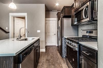 a kitchen with a stove refrigerator and a sink
