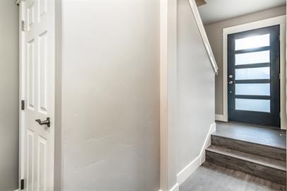 A white door is on the left and a black door is on the right.