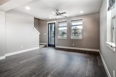 A room with a wooden floor and a ceiling fan.