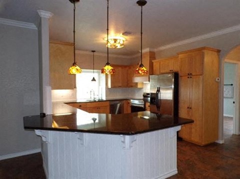 a kitchen with a large island in the middle