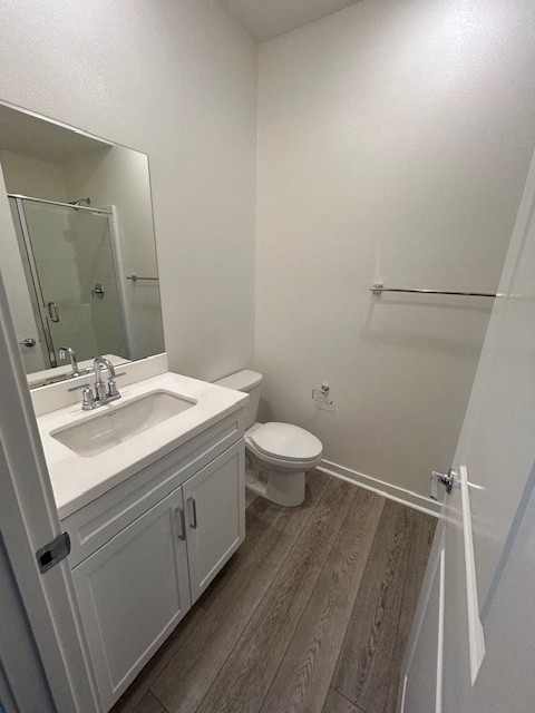 a bathroom with a sink toilet and a mirror