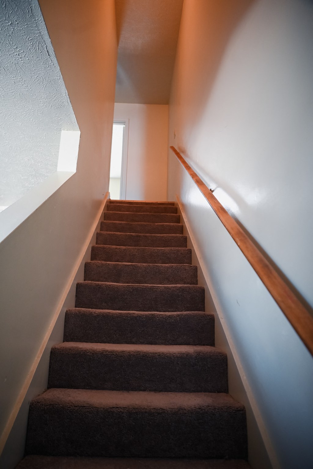 the stairs leading up to the second floor of a house