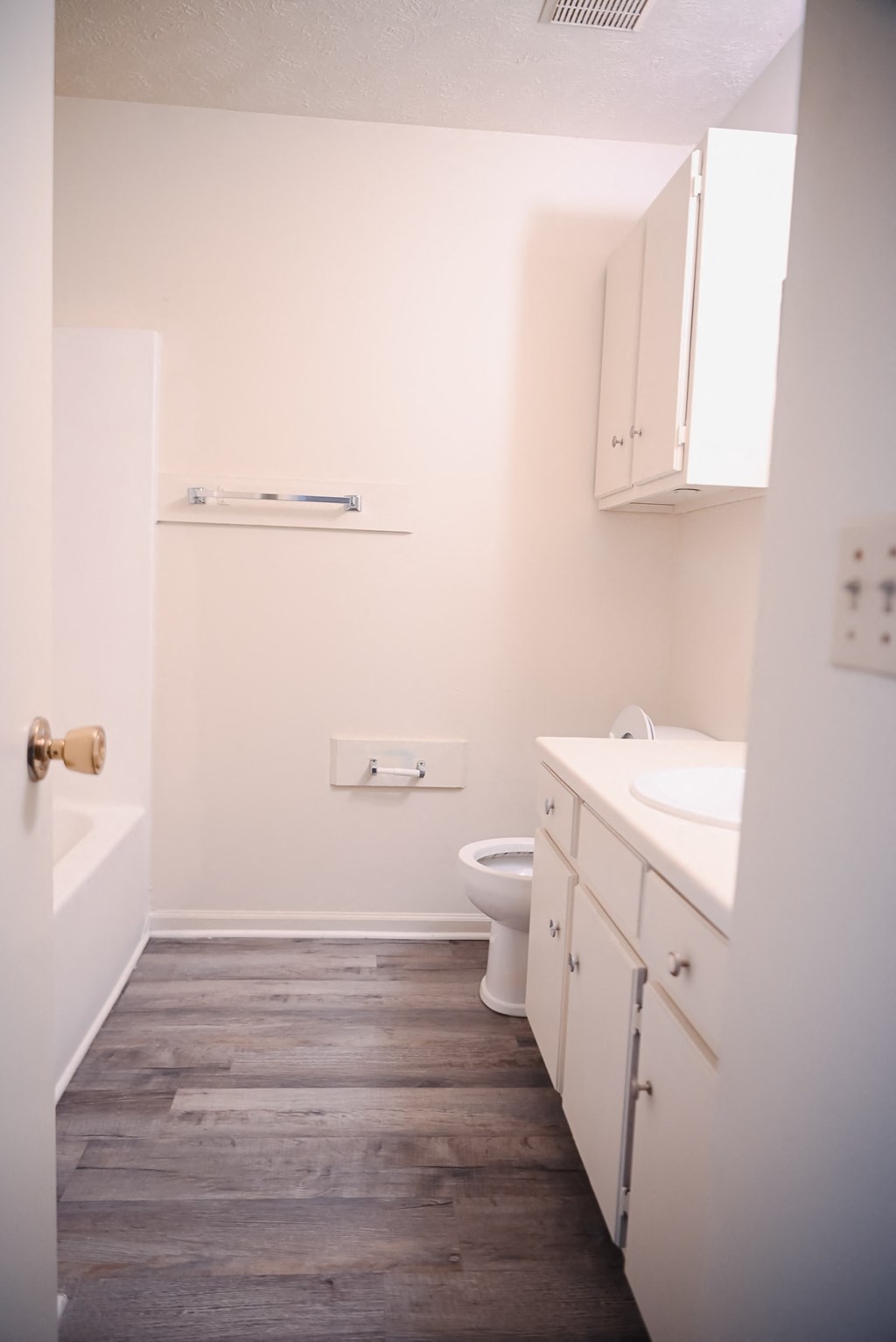 an empty bathroom with a toilet and a sink