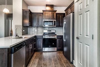 a kitchen with a stove and a refrigerator
