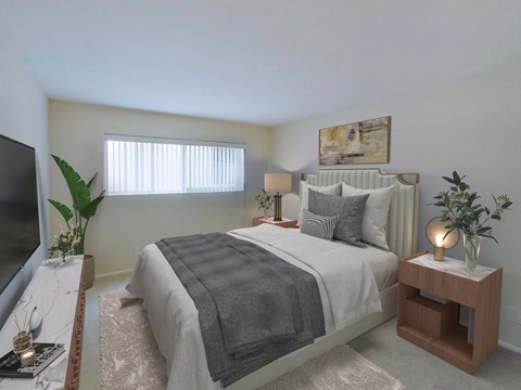 a bedroom with a bed and a tv