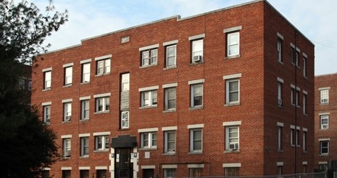 A red brick building with many windows.