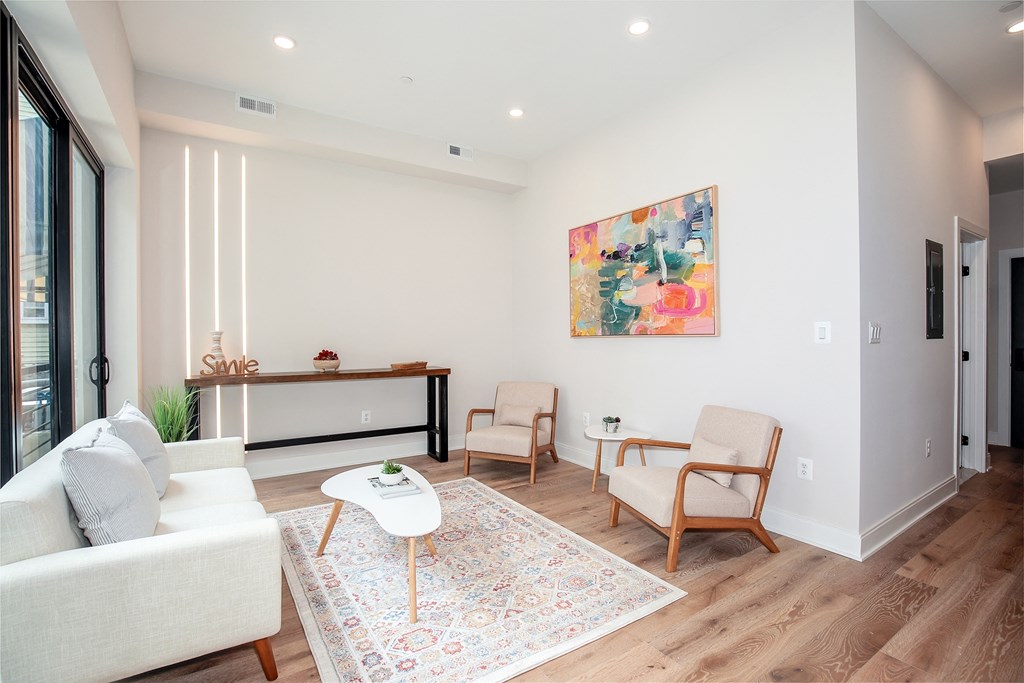 a living room with a couch and two chairs