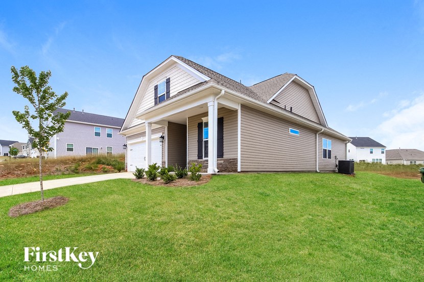 a house with a lawn in front of it