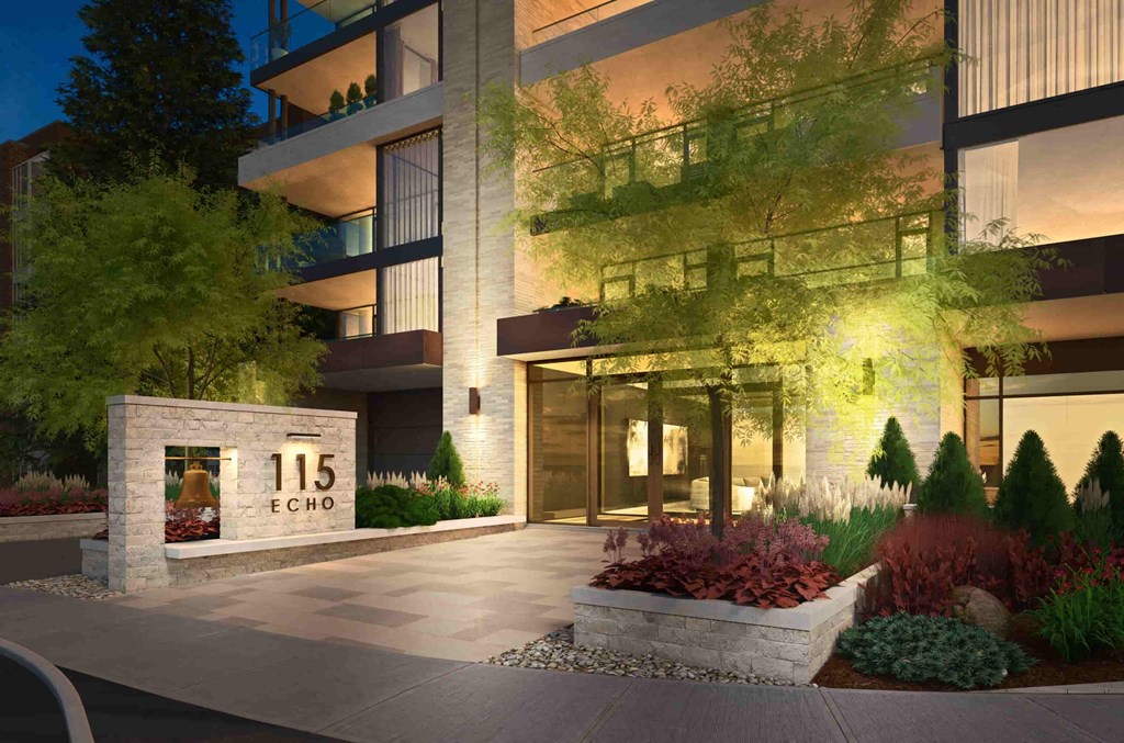 a rendering of the entrance to the 115 e cole condominium building at night