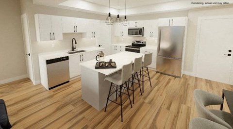 A modern kitchen with a dining table and chairs.