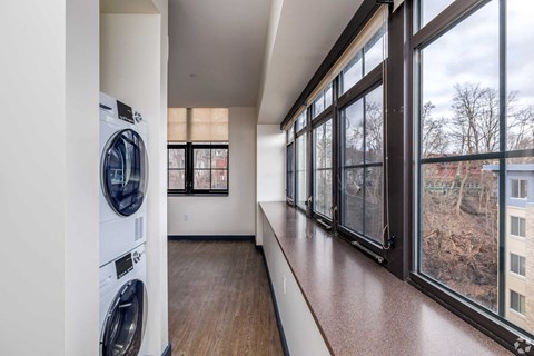 A laundry room with a washer and dryer in it.