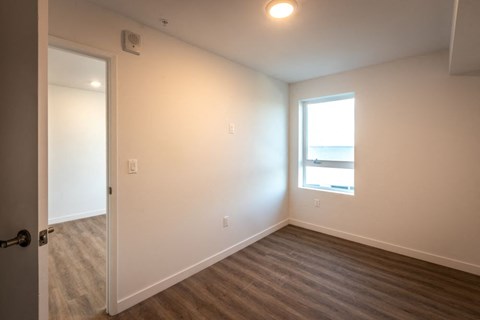 A room with a door and a window.