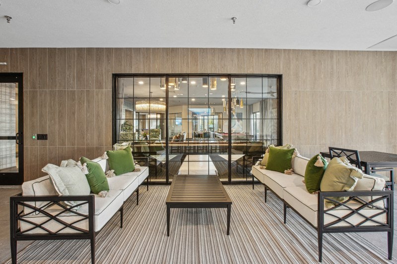 a lounge area with couches and a coffee table