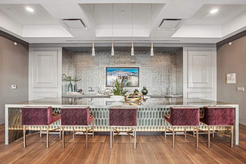a large dining room with a long table and chairs