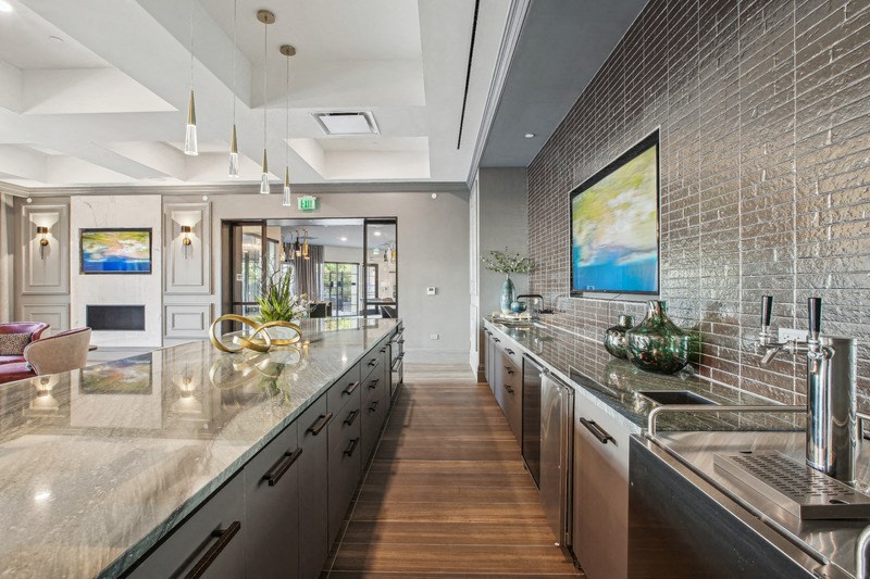 the kitchen has stainless steel counter tops and stainless steel appliances