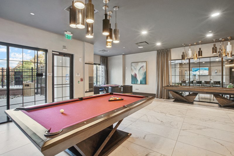 a games room with a pool table and ping pong