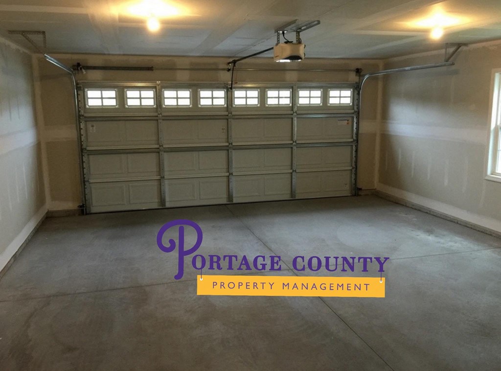 the inside of a garage with a closed garage door