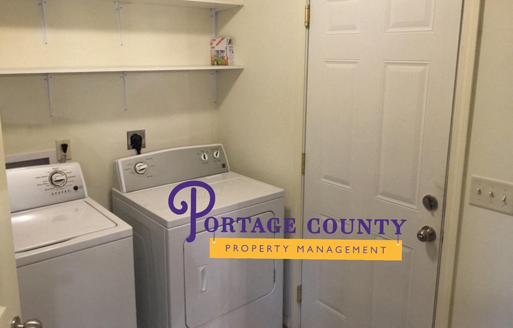 an image of a laundry room with a washer and dryer