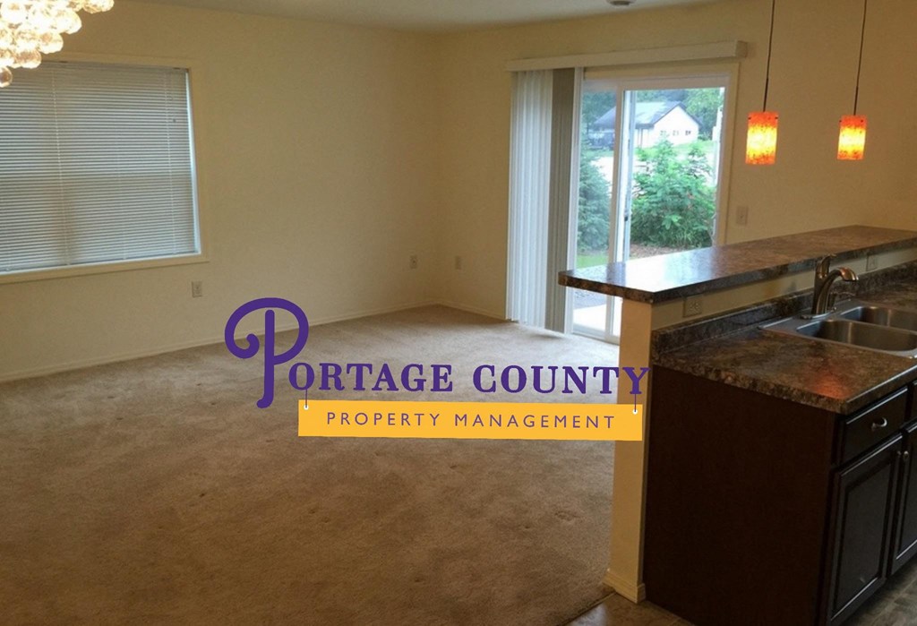 an empty kitchen with a sink and a window