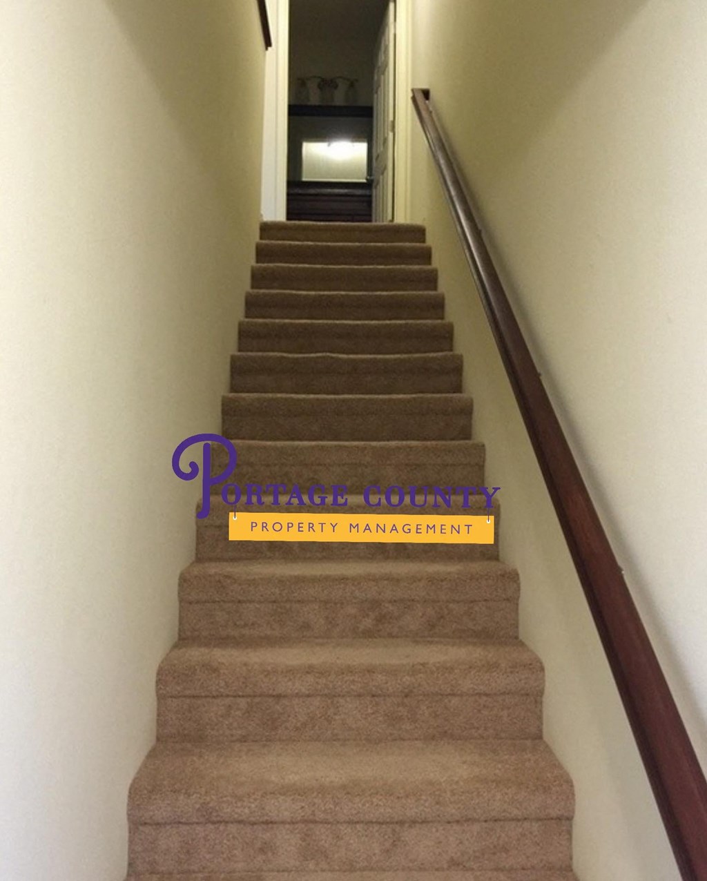 a set of stairs with a sign on the side of them