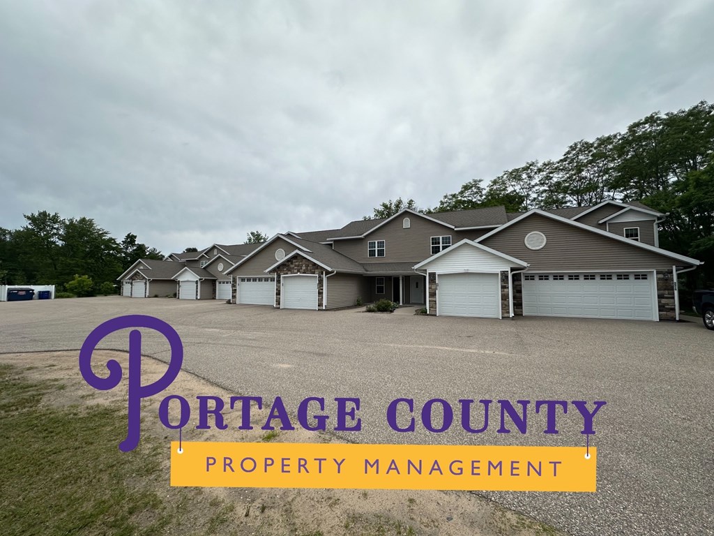 a house with a driveway in front of a row of houses