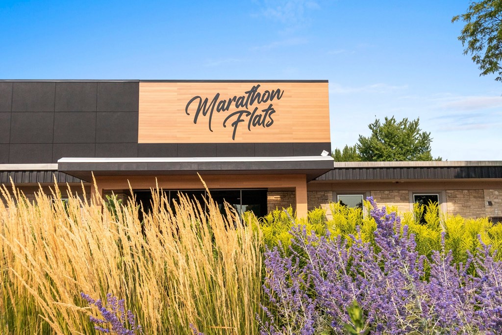 A building with a sign that says Marathon Flats.