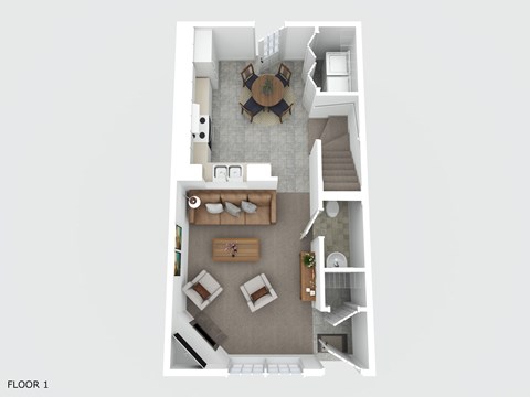 A top down view of a living room with a couch, coffee table, and stairs.