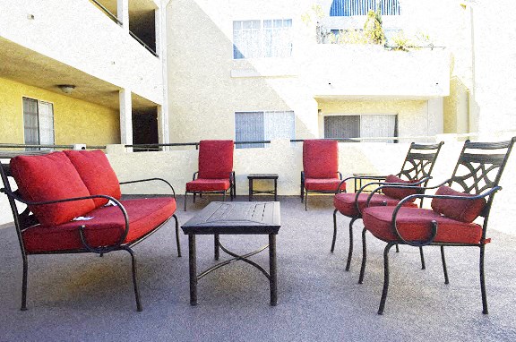 a seating area with chairs and a table