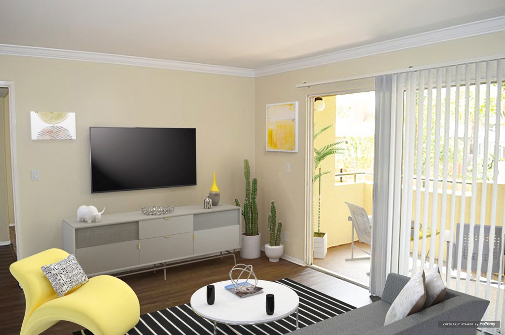 a living room with a tv and a sliding glass door