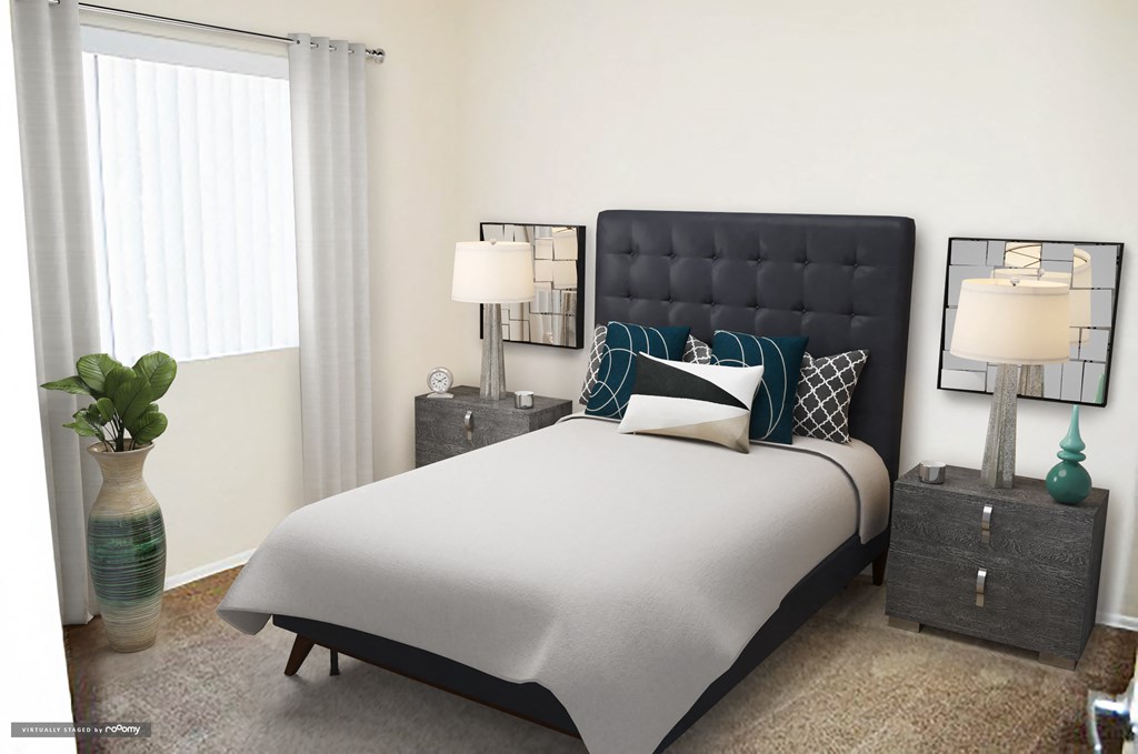 a bedroom with a large bed and a window