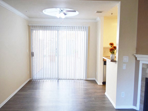 an empty living room with a sliding glass door