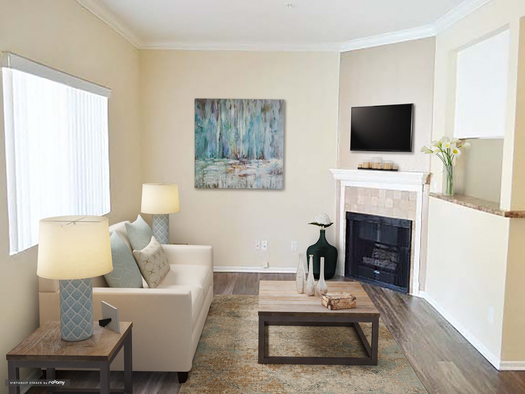 a living room with a couch and a fireplace and a tv