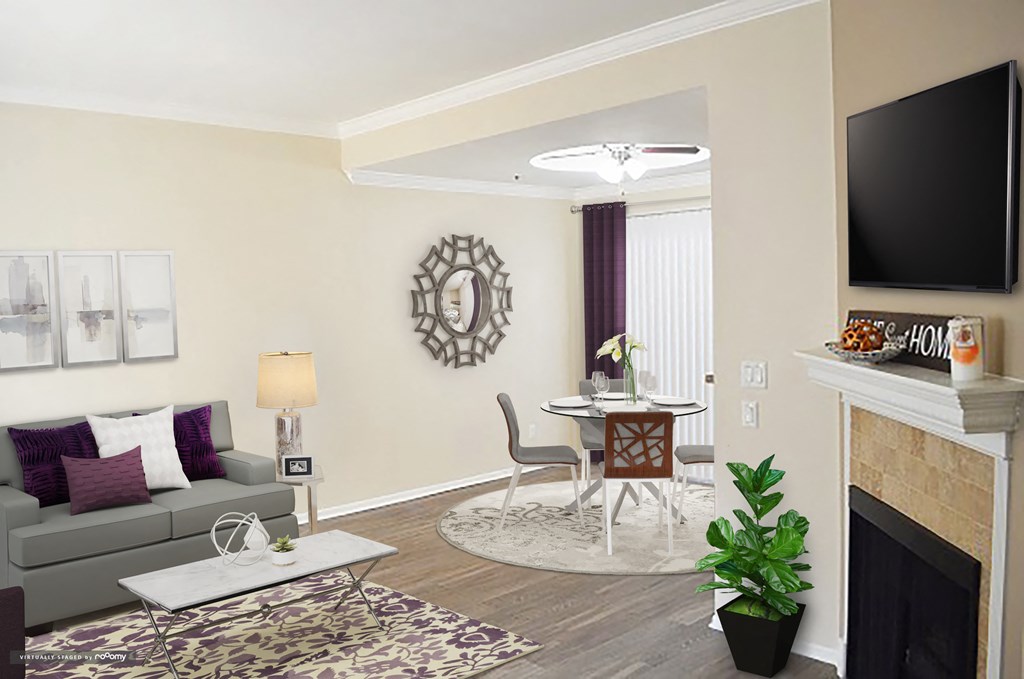 a living room with a couch and a table and a tv