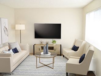 a living room with white furniture and a tv on the wall