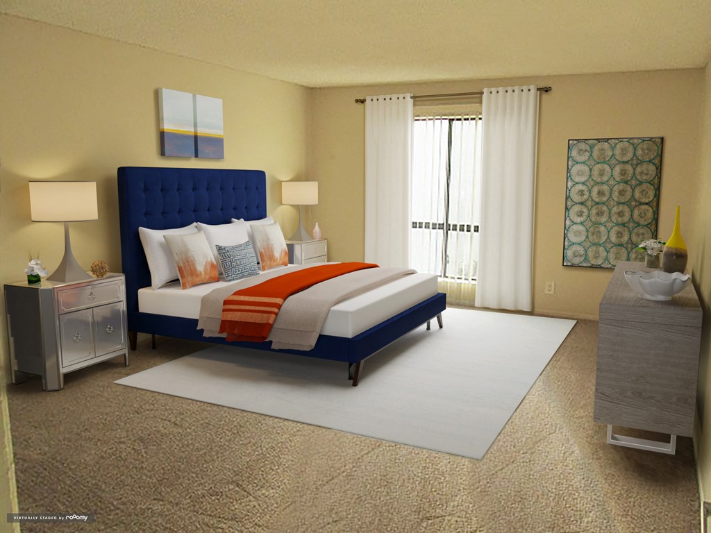 a bedroom with a bed and a white rug