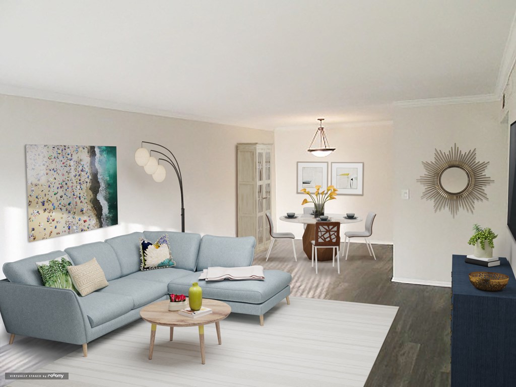 a living room with a blue couch and a table