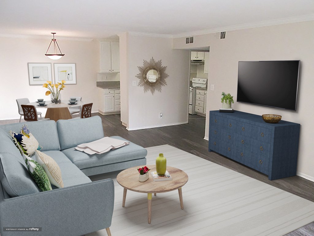a living room with a couch and a tv
