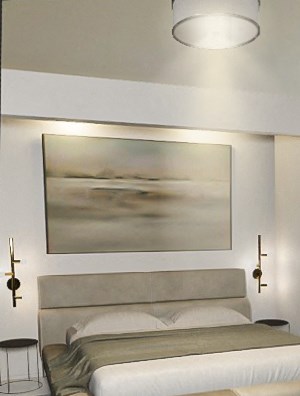 a bedroom with a bed and a chair and a painting