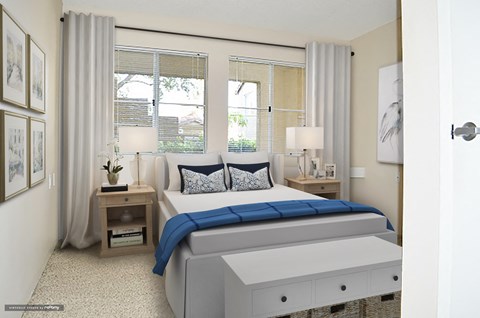 a bedroom with a bed and three windows