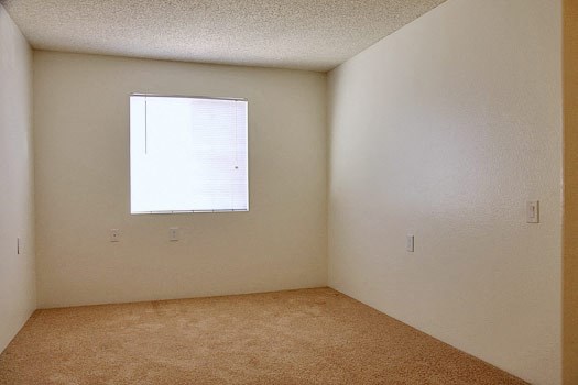 an empty room with a window in it