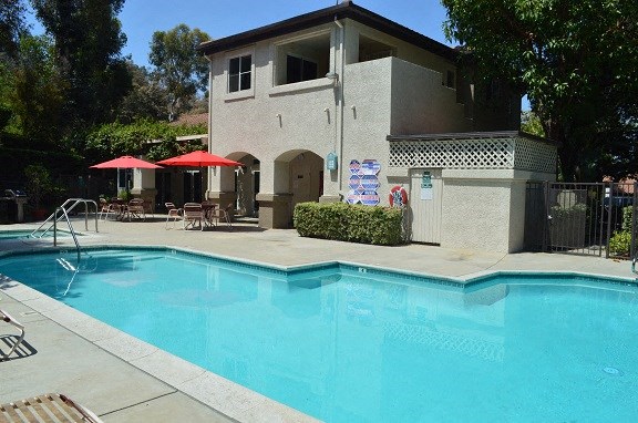 a swimming pool in front of a building
