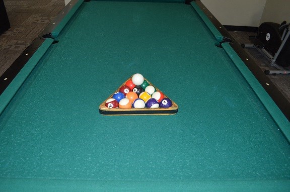 a pool table with billiard balls on it