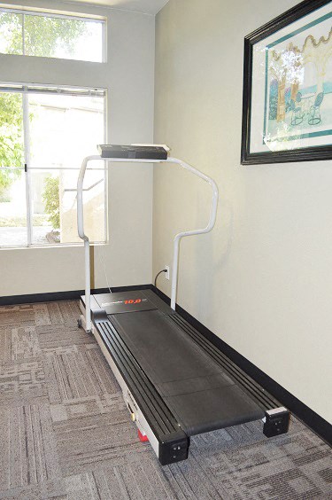 a treadmill in the corner of a room
