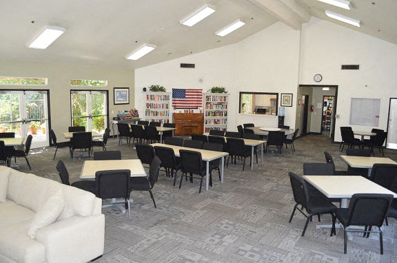 a dining room with tables and chairs