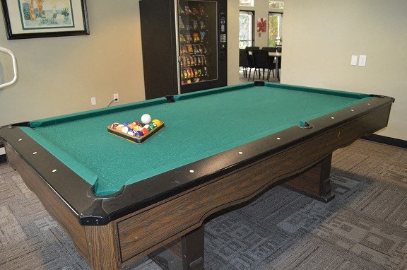 a pool table in a room with a billiard
