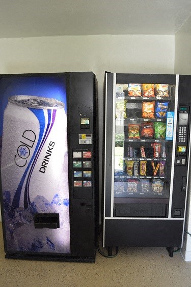 two vending machines are next to each other with drinks